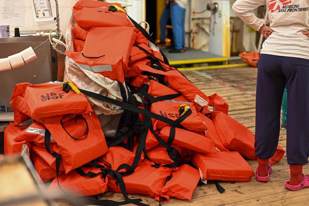 Life jackets are discarded as survivors board the ship after being rescued by the MSF team. (Geo Barents, December 2022, @Candida Lobes)