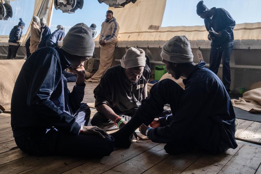 Survivors practice some language phrases on board the rescue ship a day before disembarkation in Italy. (Geo Barents, January 2023, @Nyancho NwaNri)