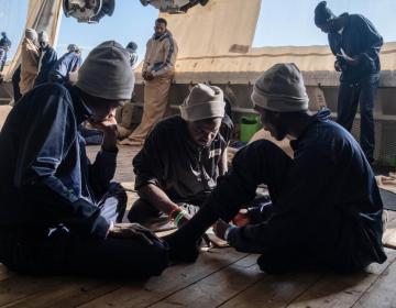 Survivors practice some language phrases on board the rescue ship a day before disembarkation in Italy. (Geo Barents, January 2023, @Nyancho NwaNri)